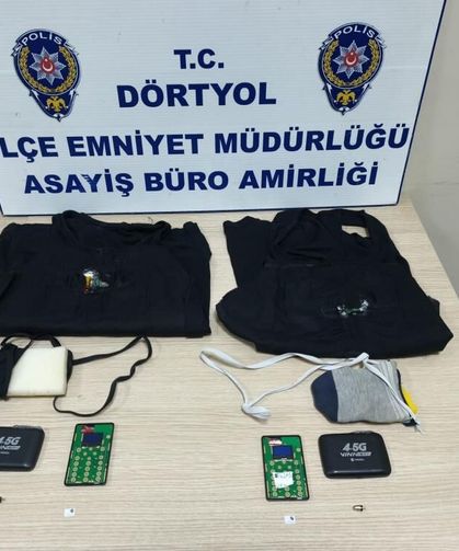 Ehliyet sınavına kopya düzeneği ile giren iki kardeş yakalandı